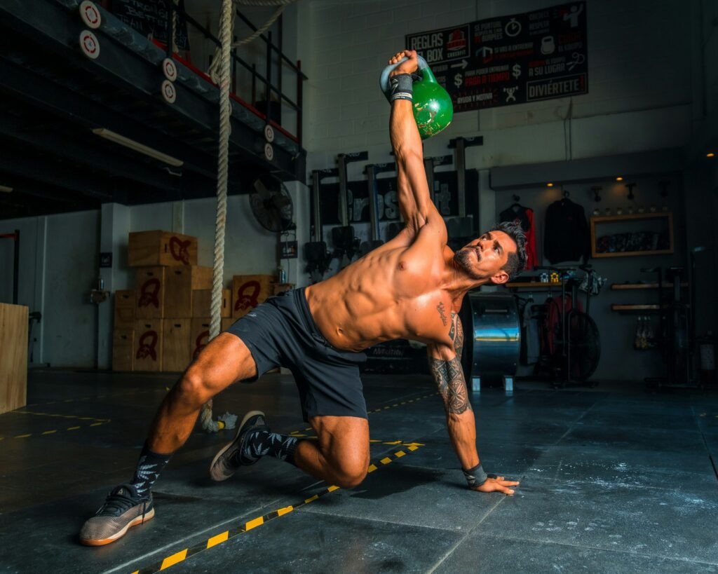 A man is doing a kettlebell exercise